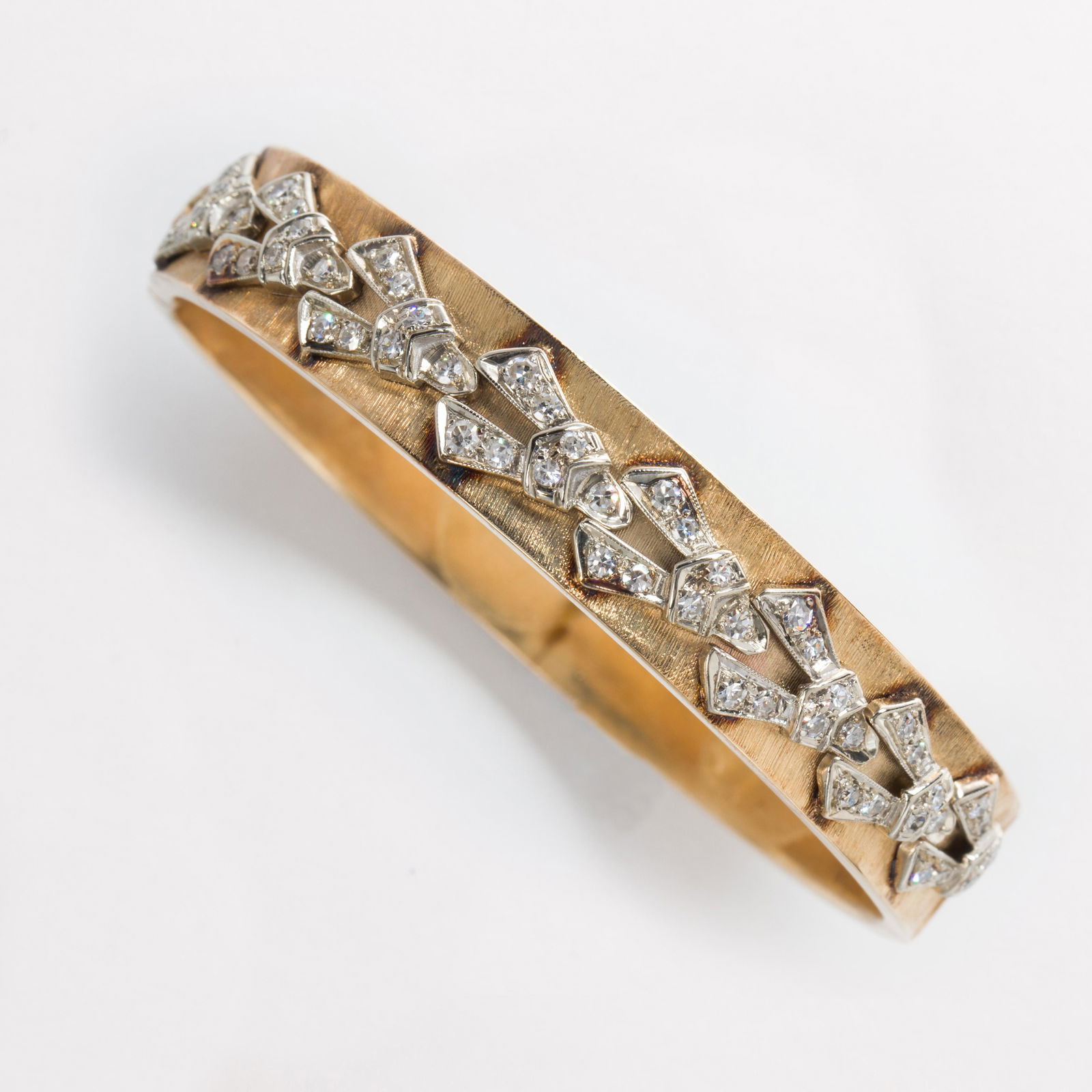 A diamond and fourteen karat gold bangle bracelet (1 of 1)