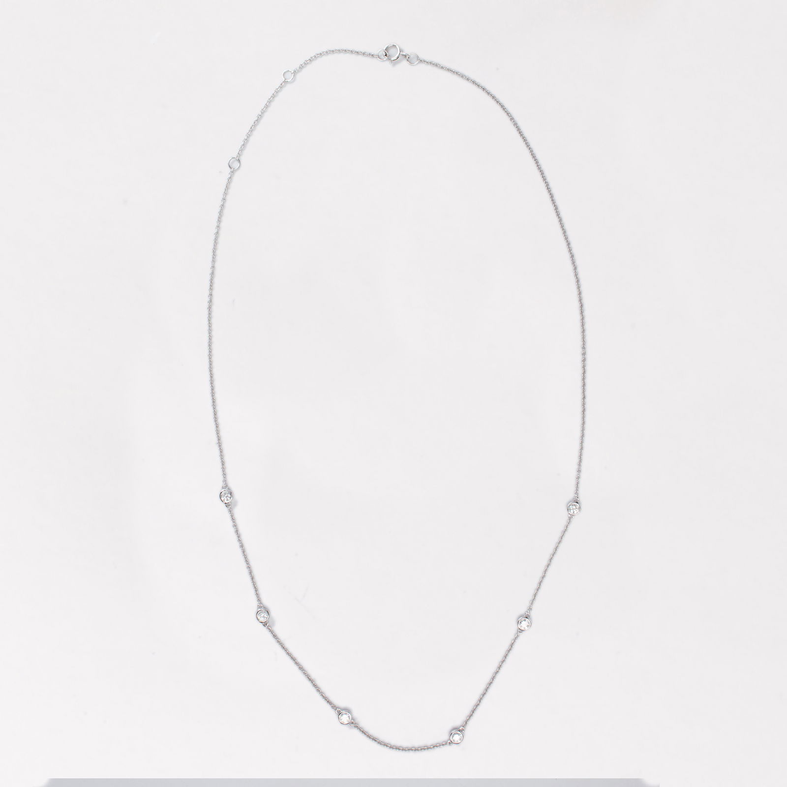 A diamond and fourteen karat gold necklace (1 of 2)