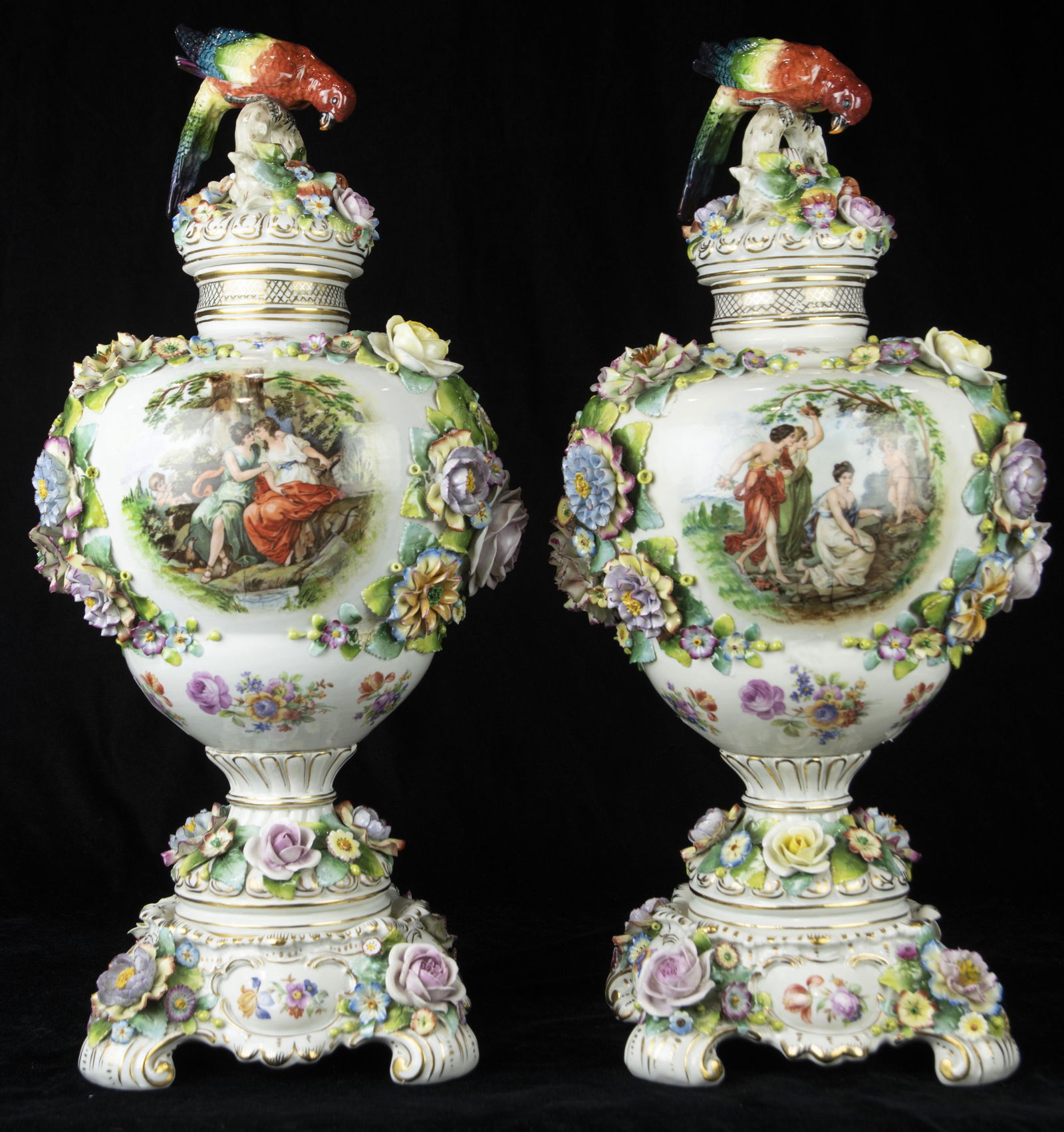 A pair of continental polychrome decorated urns (1 of 4)