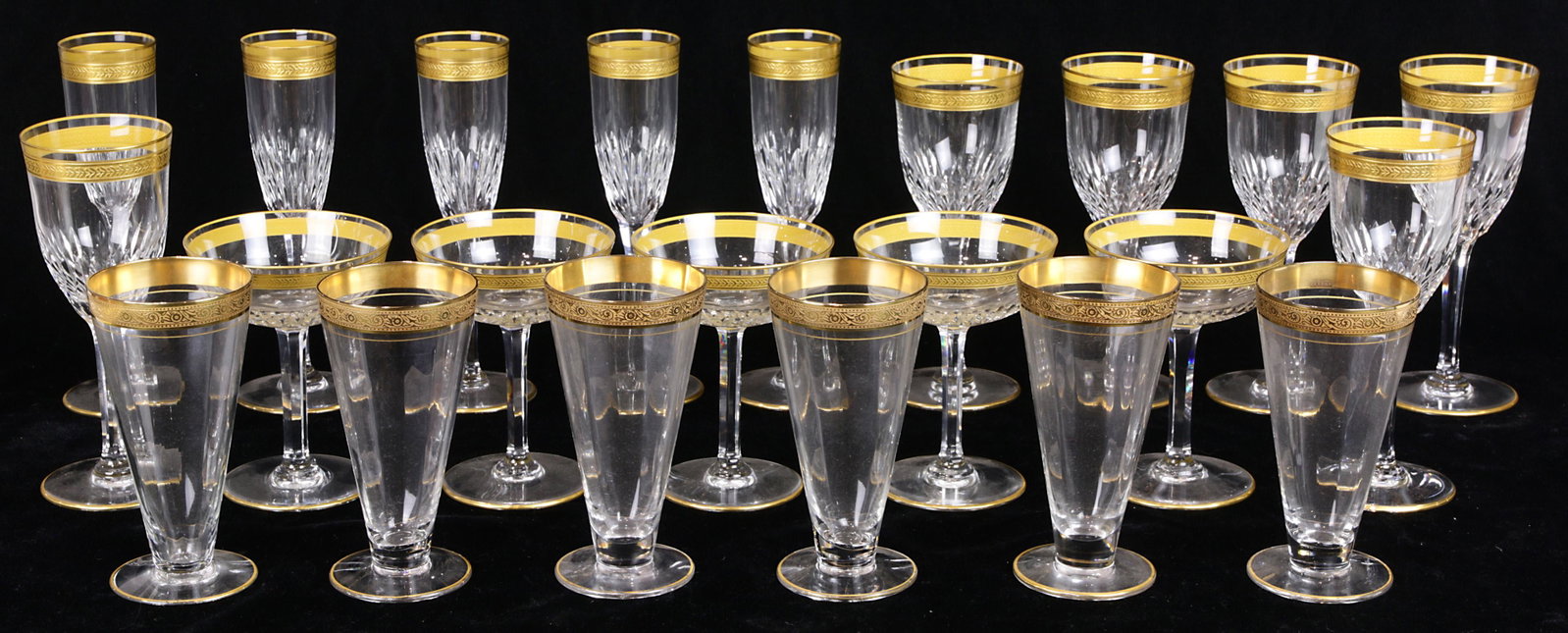(lot of 22) St. Louis crystal stemware group: (lot of 22) St. Louis crystal stemware group, each having a gilt rim above a faceted stem, consisting of (6) red wine glasses, (5) champagne flutes, and (5) champagne bowls, together with (6) associat