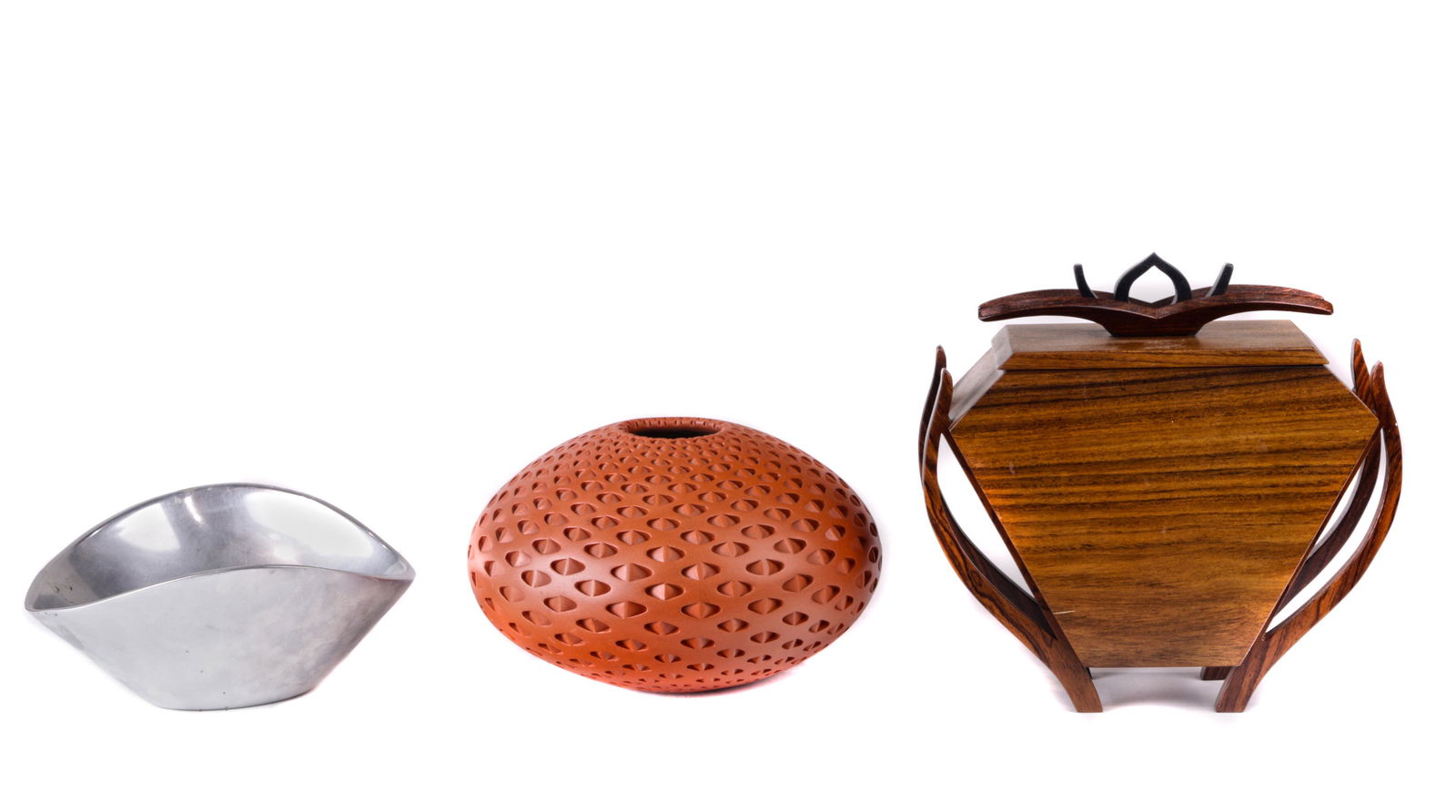 (lot of 3) Modern vessel group: (lot of 3) Modern vessel group, including a Nambe Butterfly Bowl, 7" model number 567; a scuptural lidded wood box by Patrick McCauley carved of Bolivian rosewood, cocobolo and ebony wood 8"h; and Mic