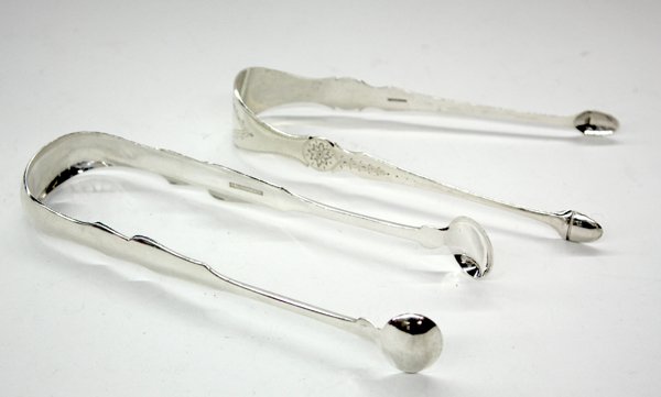 Coin silver tongs,: (lot of 2) Coin silver tongs, one by Isaac Hutton, with incised floral pattern and monogrammed 'ICH,' stamped 'HUTTON', 6.5''l; the other with shaped handles, stamped 'P. GRIFFEN', monogrammed 'MBH,' 