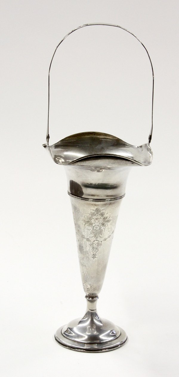 Clarence A. Vanderbilt sterling vase: Clarence A. Vanderbilt (New York) sterling silver trumpet form basket vase having scalloped, folded rim, pierced handle, finely incised foliate and ribbon pattern, upon a stepped circular weighted bas