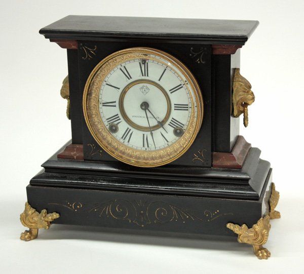 Ansonia black marble mantel clock: Ansonia black marble mantel clock with rouge molding and ormolu mounts, 10.5''h x 12.5''w x 5.5''d