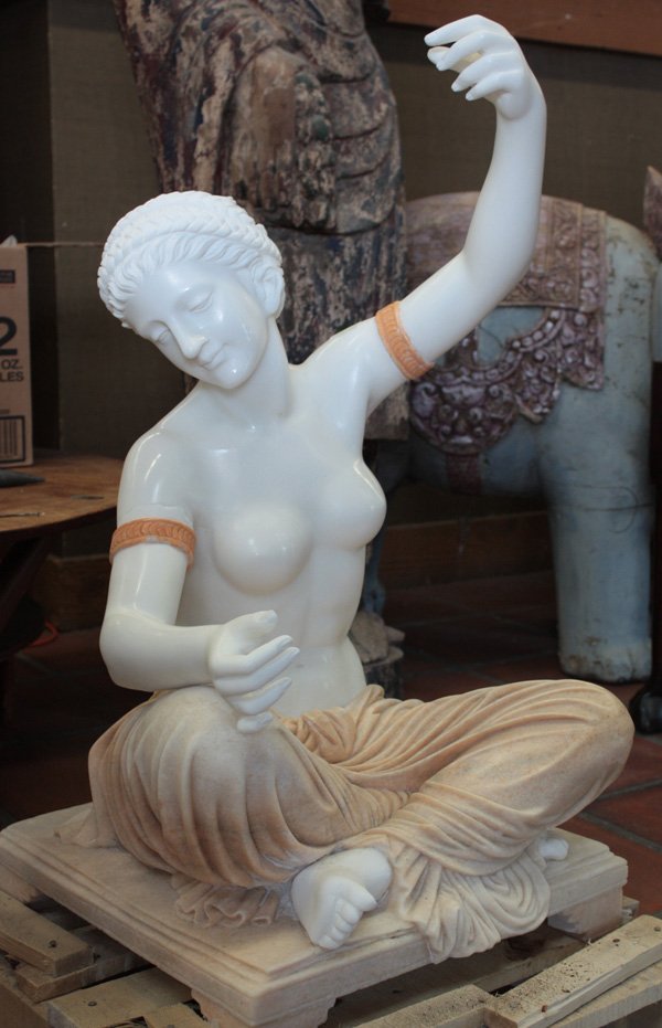Marble sculpture classical style: Brown and white marble sculpture of a seated partial nude classical beauty with braided hair, 32''h x 18''w x 18''d (arm and fingers repaired)