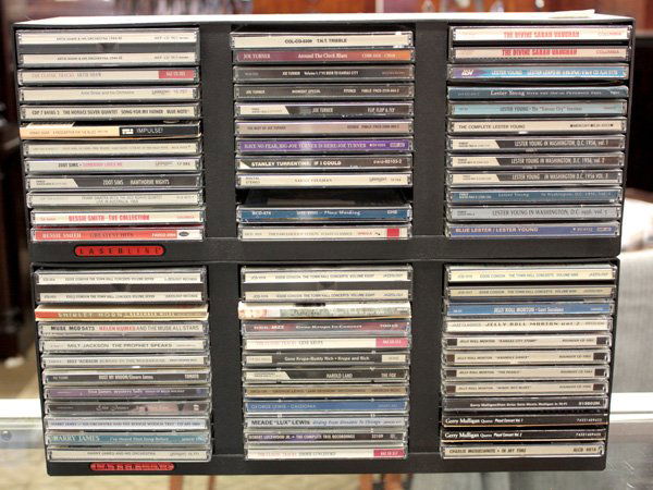 jazz blues orchestra big band cds: One shelf with 6 caddies containing jazz, blues, orchestra, and big band compact discs, artists including Artie Shaw & His Orchestra, Zoot Sims, Bessie Smith, Joe Turner, Lester Young, Sarah Vaughn, M