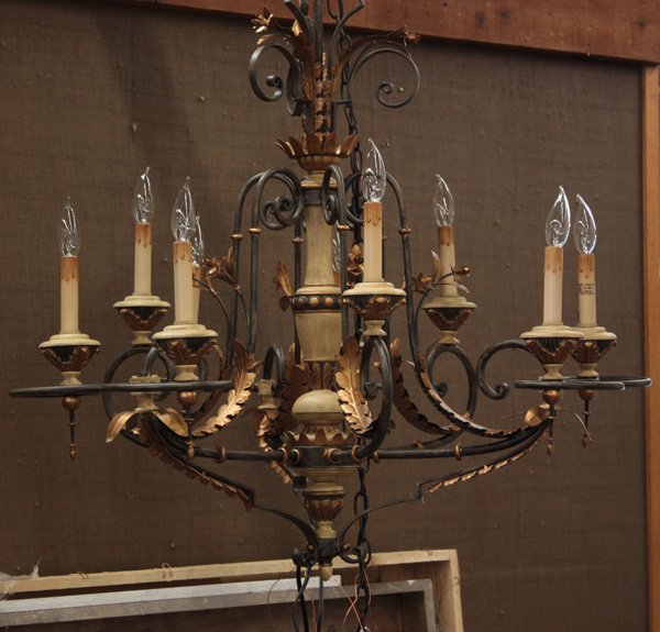 Wrought iron and gilt eight light chandelier: Eight light chandelier with bent wrought iron and gilt leaves and flower buds, 36''h x 34''d. This lot is being sold on behalf of the Bankruptcy Trustee, and is not subject to a buyer’s premium.