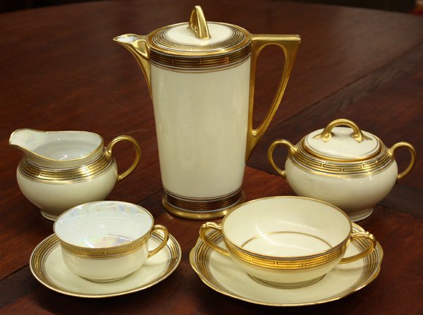Bavarian Art Deco porcelain service: (lot of 92) Bavarian Art Deco porcelain table service with gold Greek key border, consisting of 11 dinner plates, 11 bread plates, 12 salad plates, 12 berry bowls, 10 consommes with 10 saucers, 11 tea