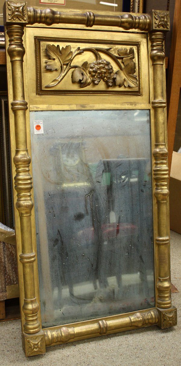 American Federal/Empire mirror: American Federal/Empire water gilt mirror, the upper panel with relief of grape and vine, pilaster bordered with rosette corners, 47''h x 23''w