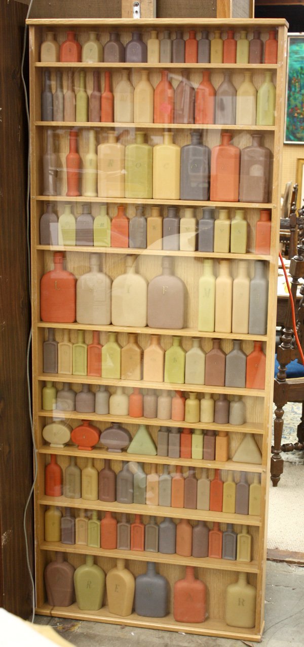 Sculpture, Maria Porges, Circular Times, bottles: Wooden shelf with wax bottles, ''Circular Times II,'' 1998, by Maria Porges (Californian, b.1950), overall: 69.75''h x 27.75''w x 4.125''d. Denver Art Museum Deaccession.