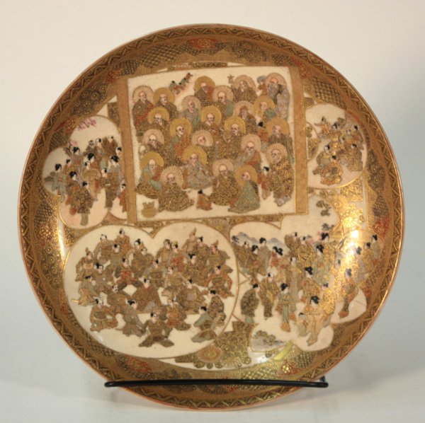Japanese Satsuma Plate, Meiji, Ryugetsu: Japanese Satsuma ware plate, Meiji period (1868-1911), the interior well decorated with various figural panels, including Buddhist rakan, samurai warriors, courtiers and couples in a spring landscape,