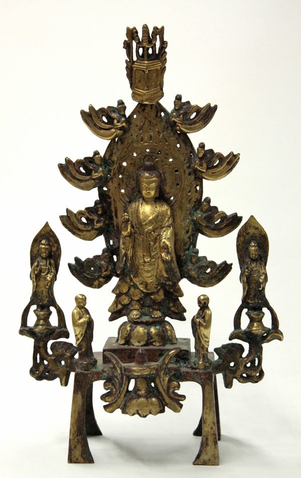 Chinese Gilt Bronze Buddhist Triad, Wei Style: Chinese gilt Buddhist triad, Northern Wei style, centered by a standing image of Gautama Buddha in the abhaya and varada mudras repeated by the two small bodhisattva figures to either side supported b