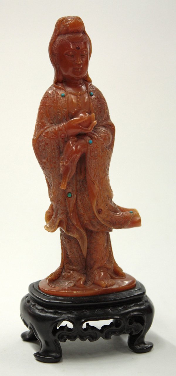 Chinese Soapstone Guanyin: Chinese soapstone carving of Guanyin, possibly tianhuang shi, shaped as a standing bodhisattva in brocade patterned robes accented with colored stones, the deity holding a sacred jewel and an amphora