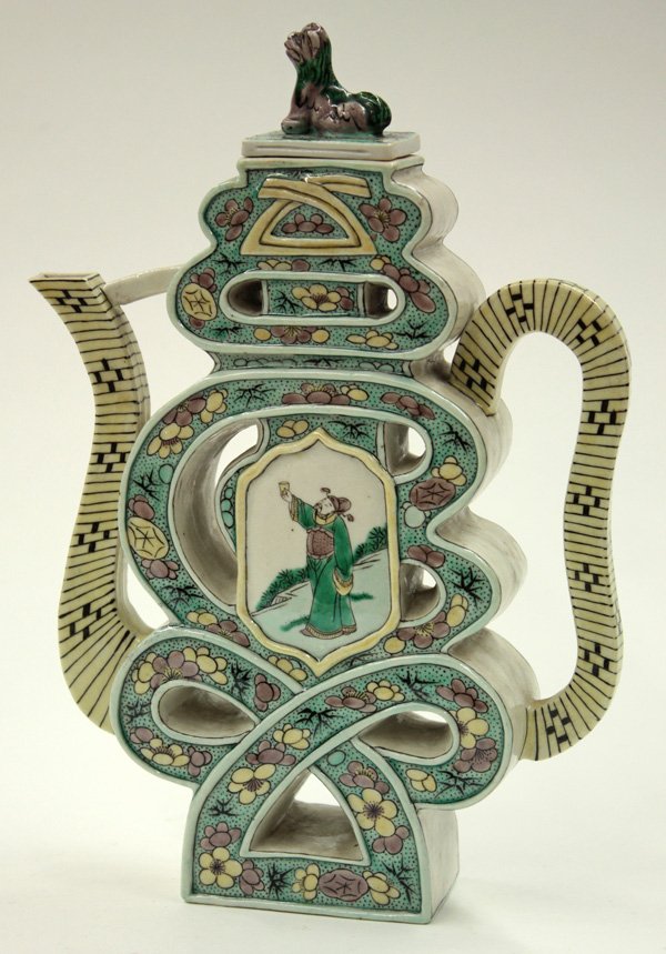 Chinese Famille Verte Puzzle Pot: Chinese famille verte puzzle pot, molded as an abstract character painted with floral sprays in yellow, green, aubergine and black and centered by a figural panel of a sage to either side, the yellow 