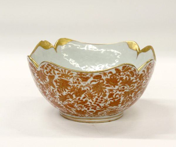 Chinese Export Gilt/Orange Enamel Serving Bowl, Q: Chinese export gilt and orange enamel foliate-edged serving bowl, Qing dynasty, the deep interior well painted with leafy floral sprays, the sloping exterior sides with further blossoms together with 