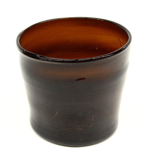 Art glass vessel: Art glass vessel having non-uniform grooves and shape, bubbles included throughout, root beer brown color, broken lip form pontil, 7''h x 8.5''d. Denver Art Museum Deaccession.