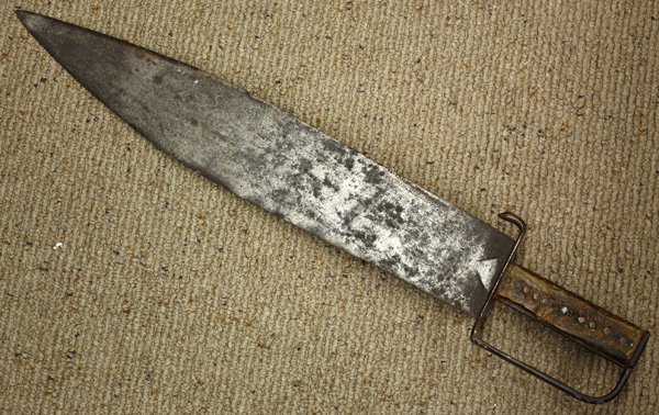 Eary Polynesian short sword, possibly 17th centur: Eary Polynesian short sword, possibly 17th century or earlier with engraved blade, 24.5''l overall (repairs to antler handle grip)