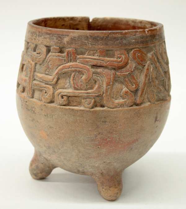 Mayan tripod terra cotta bowl: Mayan tripod terra cotta bowl with carved decoration (triangular repair), 6''h x 5''w. Denver Art Museum Deaccession.
