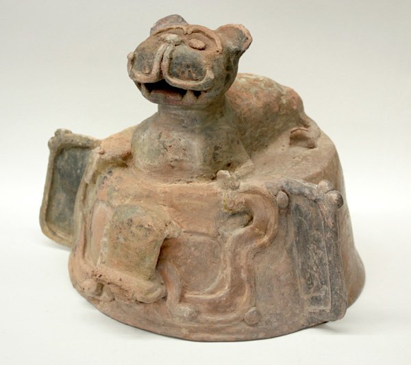 Mayan covered urn: Large lidded Mayan ceramic urn , 550 - 950 A.D. A couchant feline with open mouth forms the top of lid, reservoir decorated with powerful mask in front, 15''h x 14''d with lid. Denver Art Museum Deacc