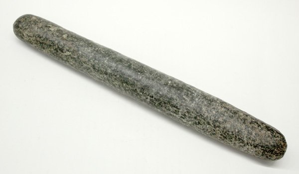 Pre-Columbian figure: Pre-Columbian Central American Mano for grinding corn, volcanic stone, 14''l. Denver Art Museum Deaccession.