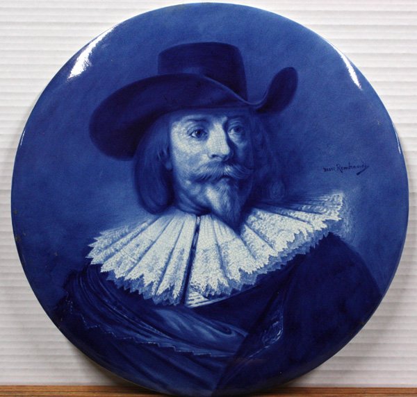 Delft hand-painted plaque of Rembrandt: Late 19th/early 20th century Delft hand-painted plaque of Rembrandt, after one of his self portraits, underglaze blue mark and impressed Joost Thooft Labouchere, 17.5'' diameter