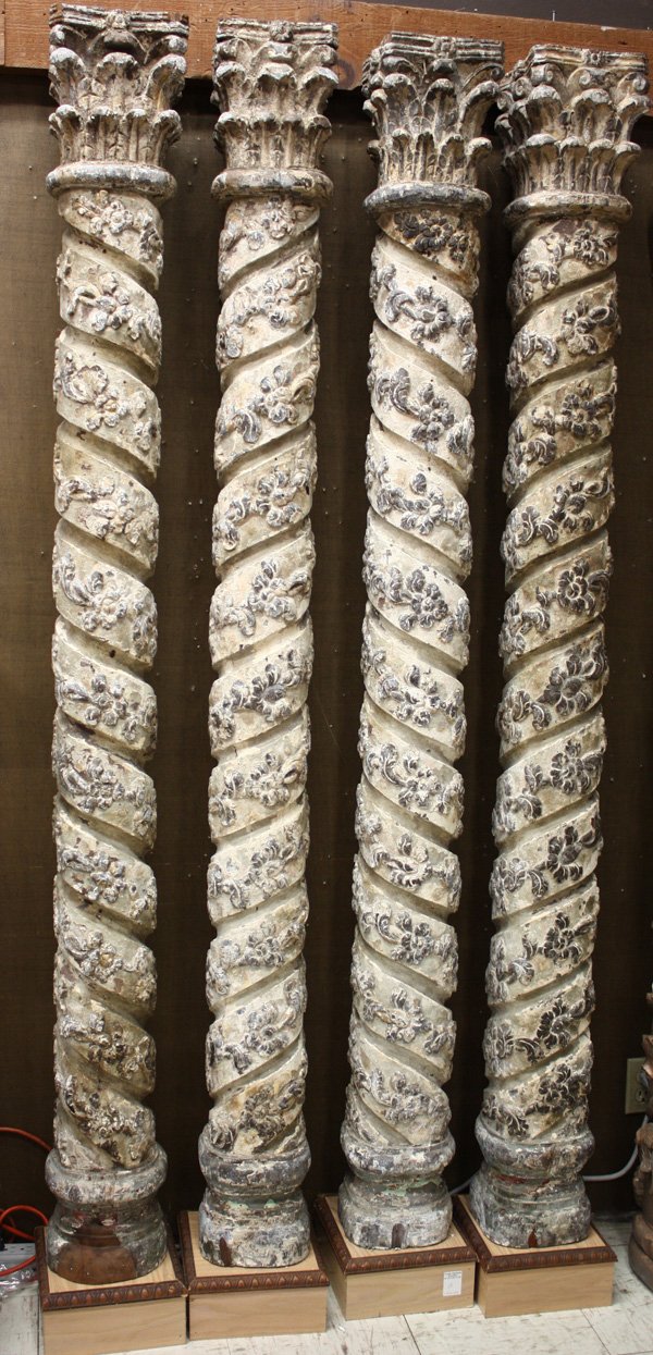 carved columns, Byzantine: Set of four carved columns purportedly from a Spanish Byzantine era church, with Corinthian capitols, spiral fluting and raised foliate with traces of gilt, mounted on later square wood bases, columns