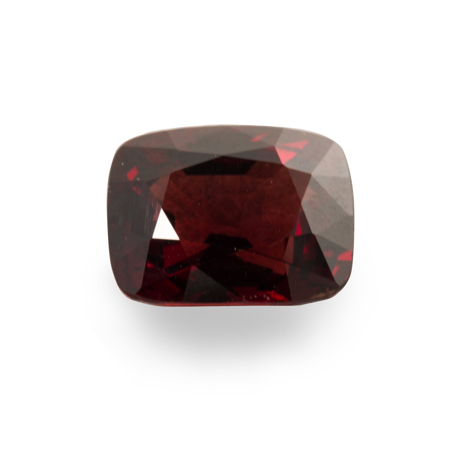 An unmounted red spinel: An unmounted red spinel a cushion-cut spinel, weighing 5.04 carats; accompanied by GIA report no. 1206196781, April 15, 2019, stating natural spinel, transparent, red, no indication of treatment, 5.04