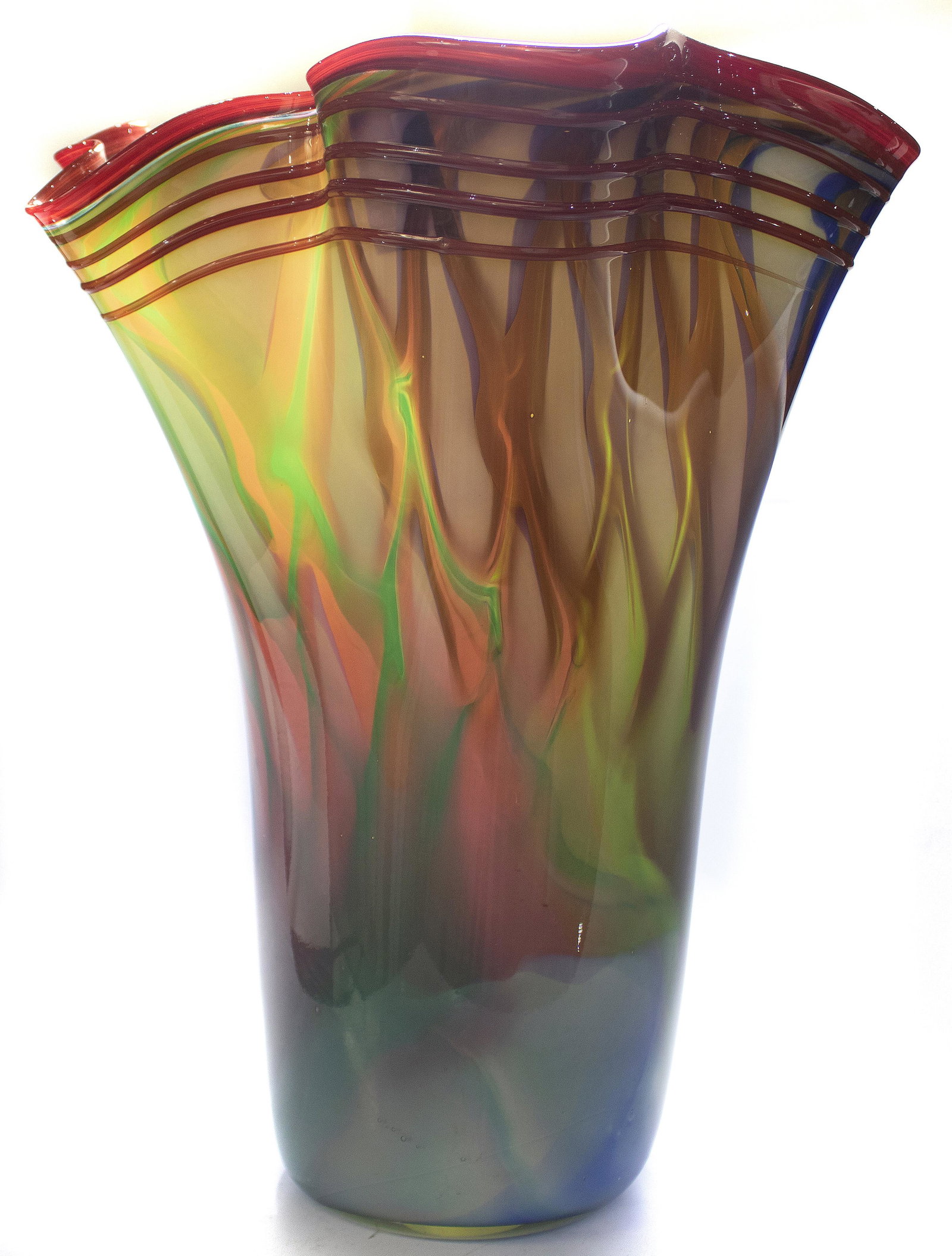 Massive contempary handblown stretch art glass vase: Massive contempary handblown stretch art glass vase in pink, green and blue with red threaded border and yellow interior 16.5"h