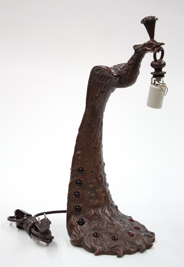Art Nouveau style patinated bronze peacock lamp: Art Nouveau style patinated bronze peacock lamp with jeweled base, indistinctly stamped, 16''h (lacking shade)