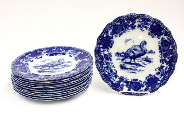 Ridgways England flow blue ceramic turkey plates: Set of twelve Ridgways England flow blue ceramic turkey plates having scalloped edges and floral patterned borders