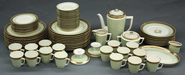 Royal Copenhagen porcelain dinnerware: (lot of 74) Royal Copenhagen porcelain dinner service having gilt and light green banding, comprising 19 dinner plates, 7 salad plates having central fruit decoration, 16 cups with 18 saucers, 8 bread