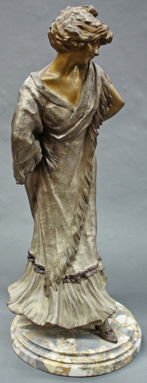 Silver and partial gold gilt bronze sculpture: Silver and partial gold gilt bronze sculpture after Lucien Alliot (French b. 1877 - 1967) Woman in Dress (Sara Bernhardt) inscribed: ''Alliot'' on socle marble base, 26.5''h