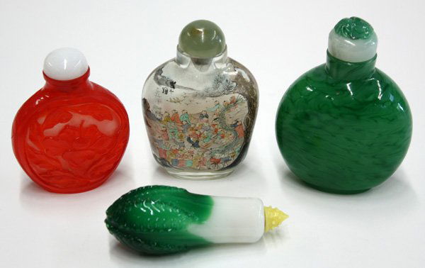 Chinese Glass Snuff Bottles: (lot of 4) Chinese glass snuff bottles: one of cabbage form topped by a yellow stopper; one inside painted bottle featuring a 'hundren children'; one of red and milky white hues carved with flower and