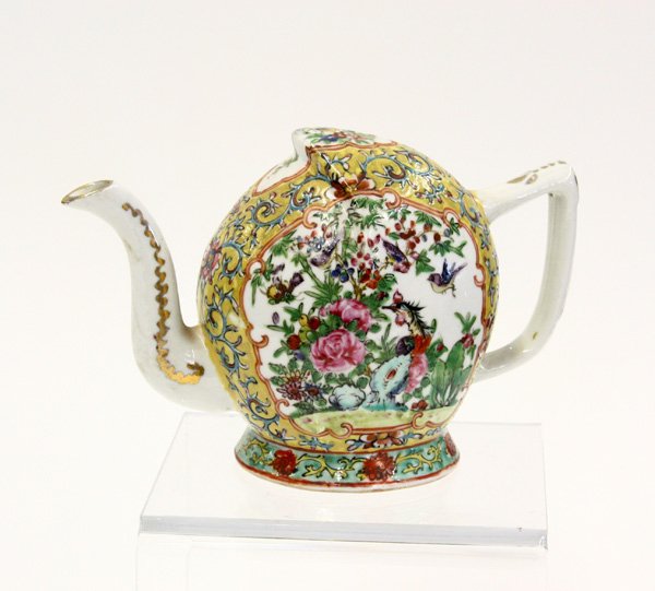 Chinese Canton Rose Peach-form Puzzle Pot: Chinese famille rose peach-form puzzle pot, decorated with flower-bird reserves on a egg-yolk yellow ground scrolled with floral tendrils and highlighted by gilt accents, with wooden stand, 8''l