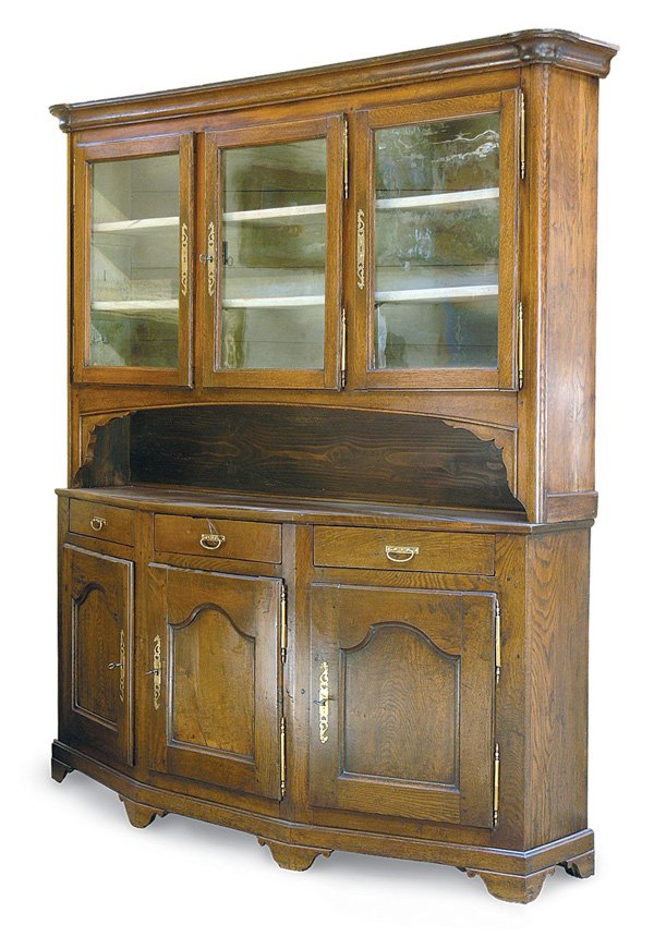 Louis XIV style oak buffet a deux corps: Louis XIV style oak buffet a deux corps, last quarter 18th century, the top section having three glass panelled doors, the central space with a bowed framed and carved corner accents, the lower sectio