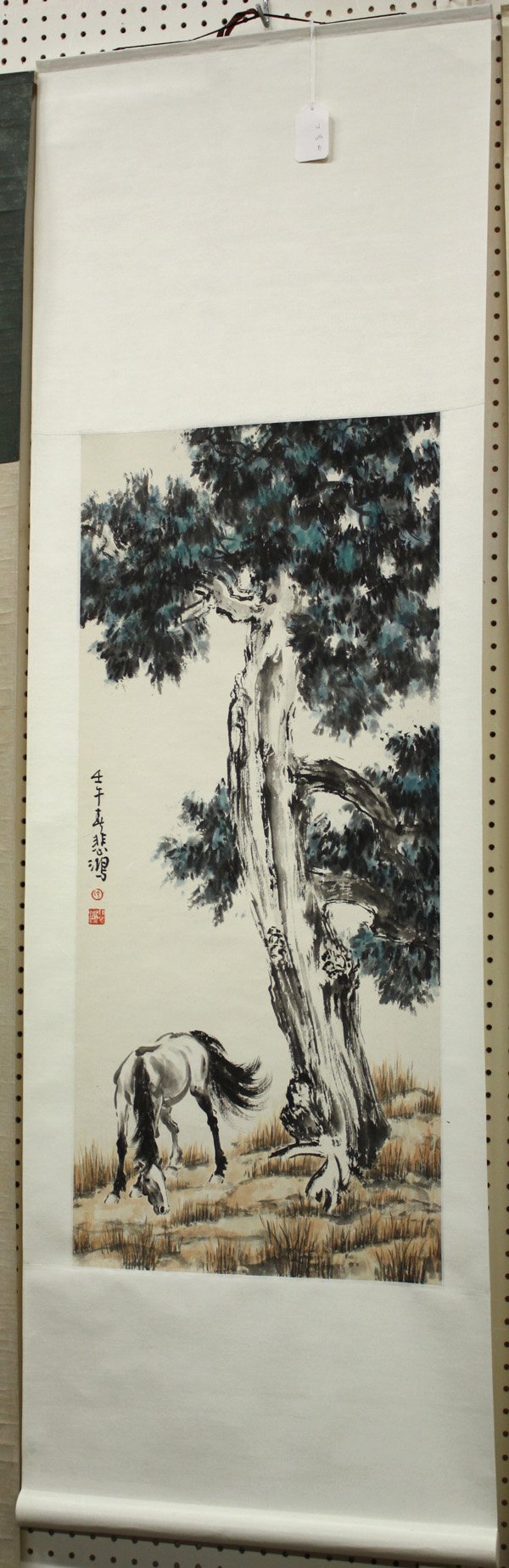 Chinese Scroll, after Xu Beihong, Horse: Chinese scroll, Horse, after Xu Beihong (1895-1953), depicting a black horse grazing under a tall tree, left inscribed with cyclical date 'renwu', bears signature 'Beihong', and two artist seals, over