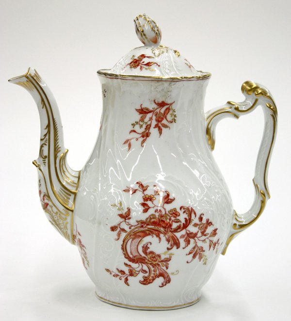 Teapot, Porcelain 19th century Continental: 19th century Continental porcelain teapot having flower bud knop, gilt accents and red foliate motif against white ground, red 'S' and crossed arrows mark to base, 9''h