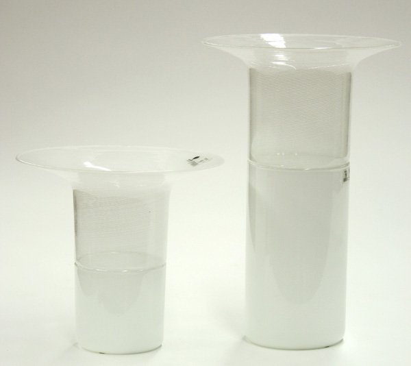 Art Glass Vases, Tapio Wirkkala for Venini: (lot of 2) Tapio Wirkkala (Finnish, 1915-1985) for Venini white glass vases having cylindrical bodies and dramatically flared rims, the upper half of white and clear striations, the bottom half solid 
