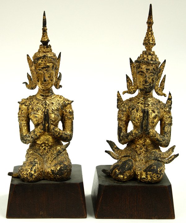 Two Thai Gilt Bronze Buddhist Figures: Two Thai gilt bronze Buddhist figures, Ayutthaya/Bangkok era, probably depicting donors or apsaras (celestial beings), each seated in an elaborate headdress and brocade robes in a pose of adoration wi