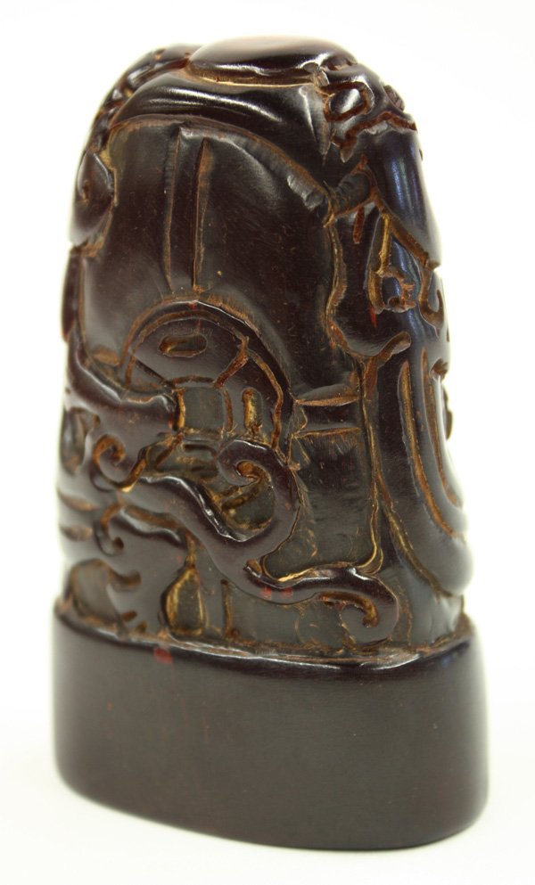 Chinese Horn Seal: Chinese small horn seal, fashioned with chilong climbing toward a jewel on the domical top and further centered by cash coins, ovoid section base reads 'Zhang Zhong', 3.25''h