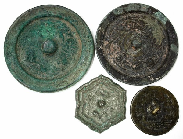 Chinese Bronze Mirrors: (lot of 4) Chinese cast bronze mirrors, including an Eastern Han style circular disk with dragon motif, 3''d; a Han style disk with classic scroll band and surname 'Lu', 3''d; a small floriform Tang s