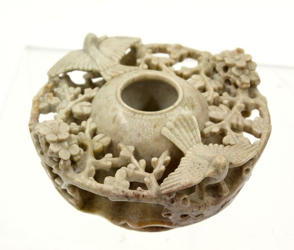 Chinese Soapstone Ink Well: Chinese carved soapstone ink well, with a pair of song birds amid flowering prunus spreading out to form an openwork collar around the small globular receptacle supported on a foliate-edged waisted ba