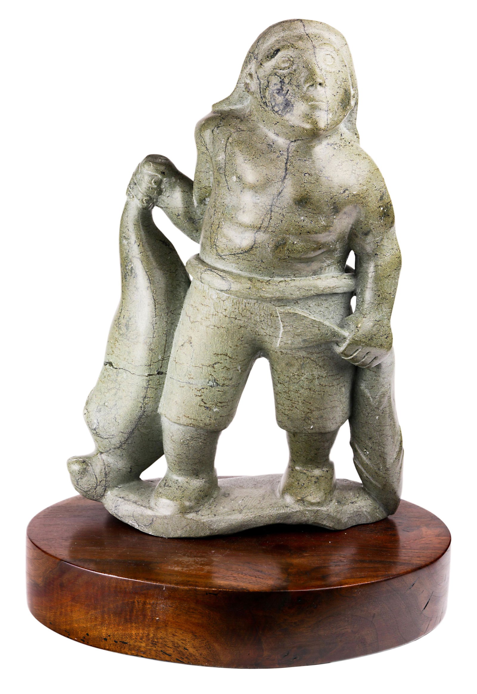 A large Inuit stone sculpture of a hunter (1 of 6)