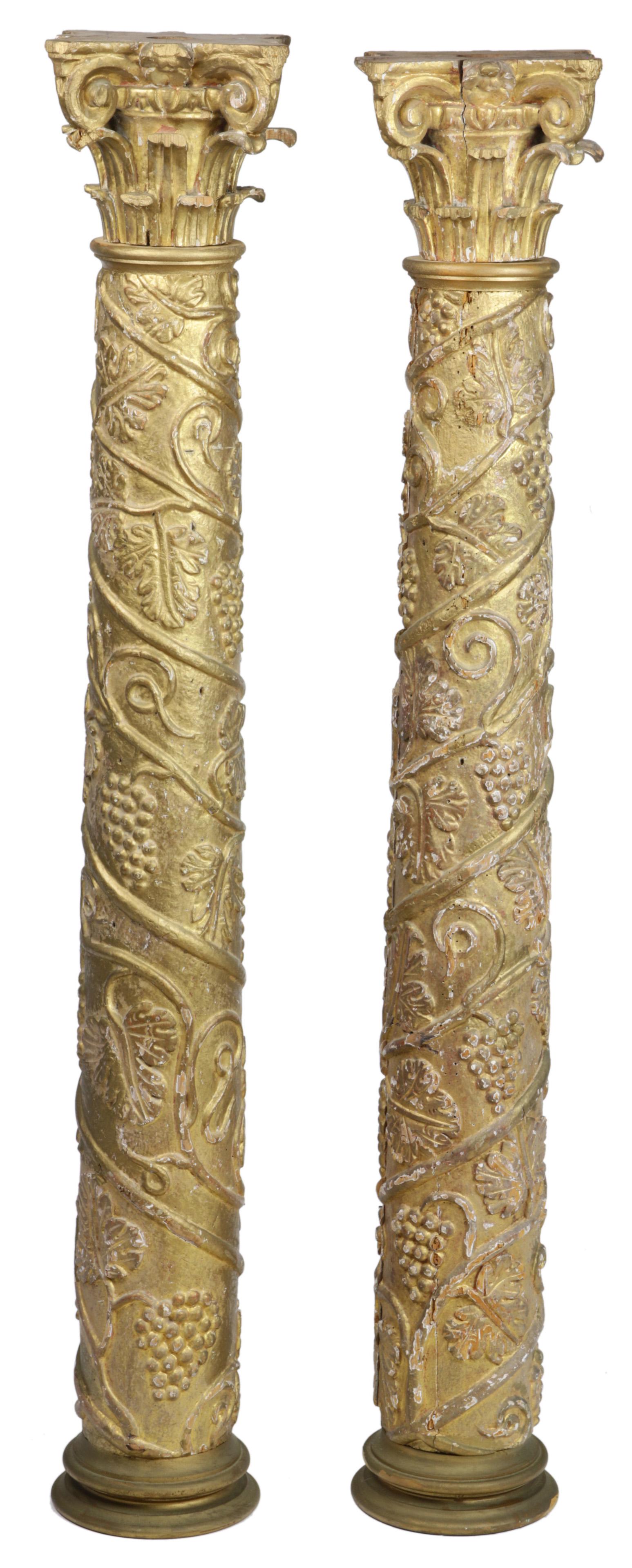 (lot of 2) A pair of Italian carved and giltwood: (lot of 2) A pair of Italian carved and giltwood columns, each having a Corinthian capital above the standard with a grape vine motif, 37"h