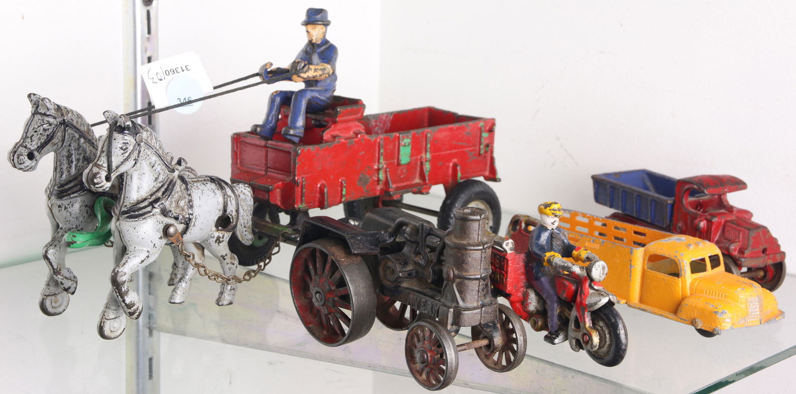 5 cast iron toys: Champion truck; Avery engine; a Crash: (lot of 5) Painted cast iron toys: a horse drawn cart; an Avery steam engine; a" Crash Car" three legged motorcycle; (2) trucks, including a dump truck by Champion, the largest 5.75"h x 10.5w