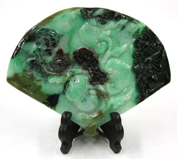 Chinese Fan-Shaped Jade Carving: Chinese jade ornament shaped as a fan carved with a pair of chilong in pursuit of a lingzhi sprig, reversed by ruyi and bats picked out from the darker inclusions contrasting with the lighter green ma