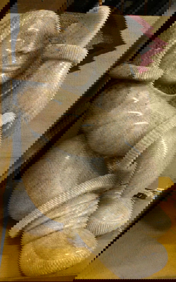 Alabaster carved Ice Fisherman: Alabaster carved Inuit sculpture, Ice Fisherman (1990) by Michael Scott (American 1958-), 19'' x 11'' x 21''. Information: Sold to benefit University of California, San Francisco