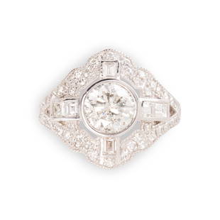 A diamond and platinum ring: A diamond and platinum ringdesigned as a bezel-set round brilliant-cut diamond, weighing approximately 1.60 carats, within pierced and millegrained geometric frame, set with single and step-cut