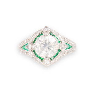 A diamond, emerald and platinum ring: A diamond, emerald and platinum ringdesigned as a round brilliant-cut diamond, weighing approximately 1.80 carats, within millegrained geometric mount, accented by channels of calibré-cut