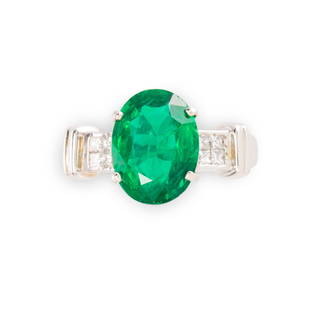 An emerald, diamond and platinum ring: An emerald, diamond and platinum ringthe oval brilliant-cut emerald, weighing 3.58 carats, four-prong set between clusters of radiant-cut diamonds; accompanied by GIA report no. 1216472916, February